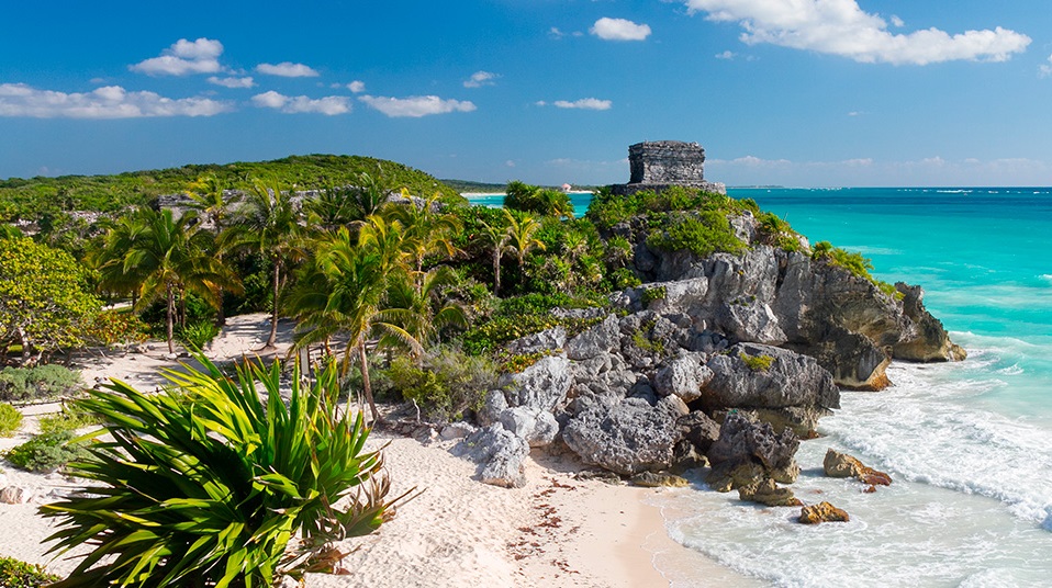 Ancient Mayan ruins of Tulum overlooking the turquoise waters of the Caribbean Sea.