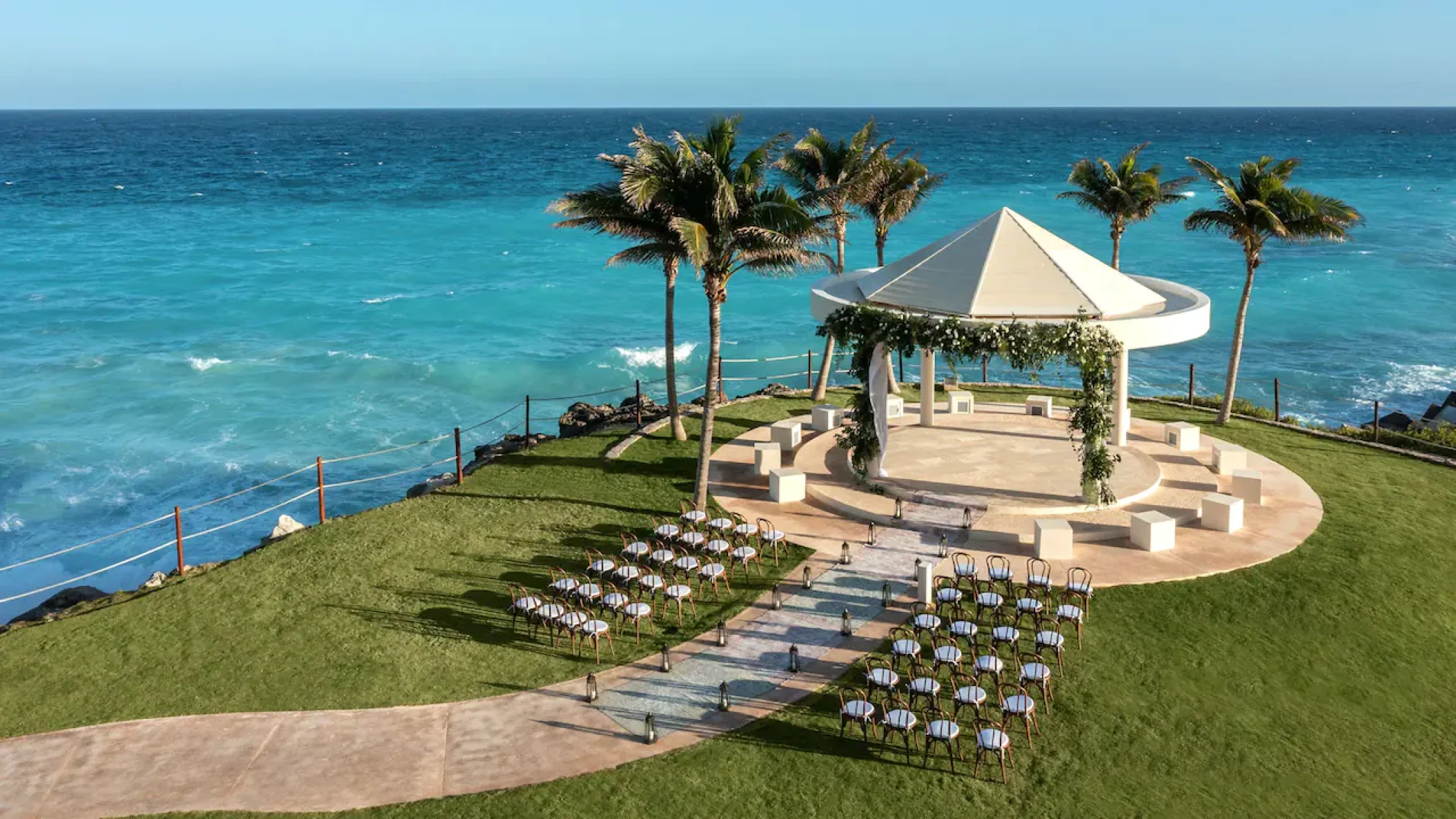 Hyatt Zilara Cancún Wedding Gazebo surrounded by palm trees and flowers