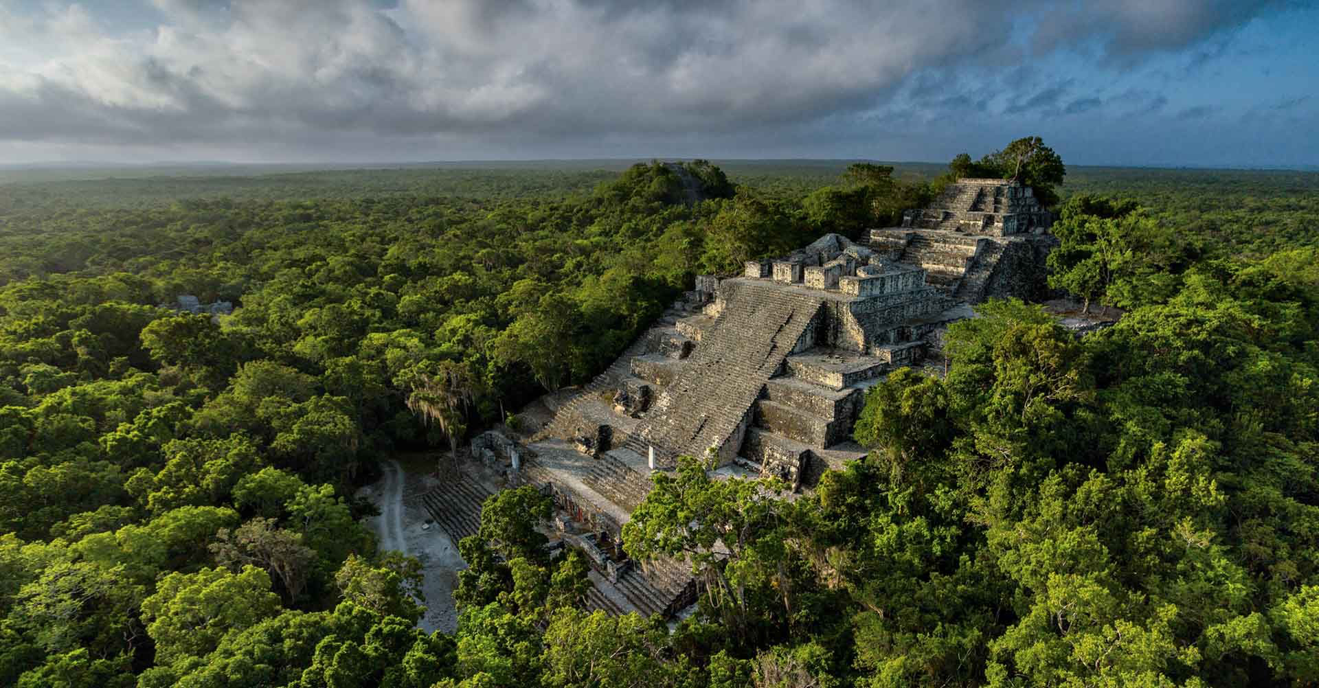 Twin pyramids of Calakmul rising over the jungle in Campeche.